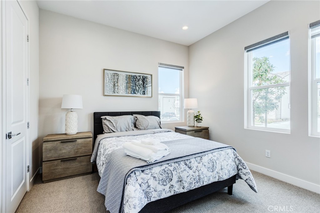 260 Holliston Lake Forest, CA 92630 - Photo 13 of 63 a bedroom with a large bed and a window