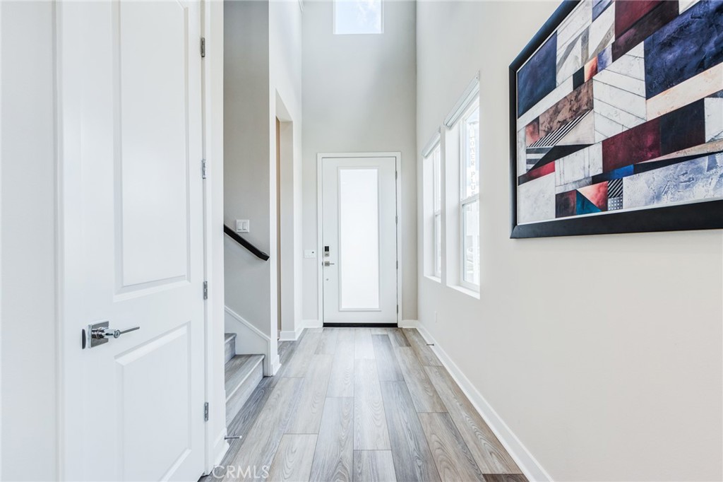 260 Holliston Lake Forest, CA 92630 - Photo 15 of 63 a view of a hallway with wooden floor and entryway