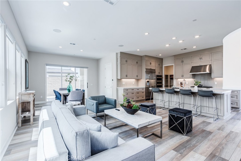 260 Holliston Lake Forest, CA 92630 - Photo 19 of 63 a living room with fireplace furniture and a wooden floor