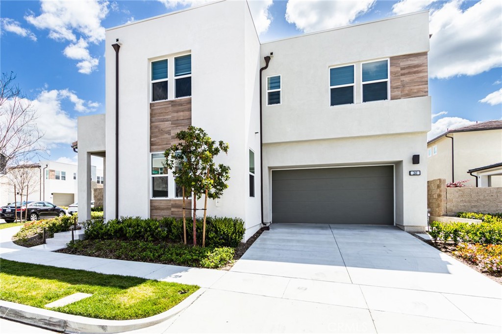 260 Holliston Lake Forest, CA 92630 - Photo 2 of 63 a front view of a house with a yard and garage