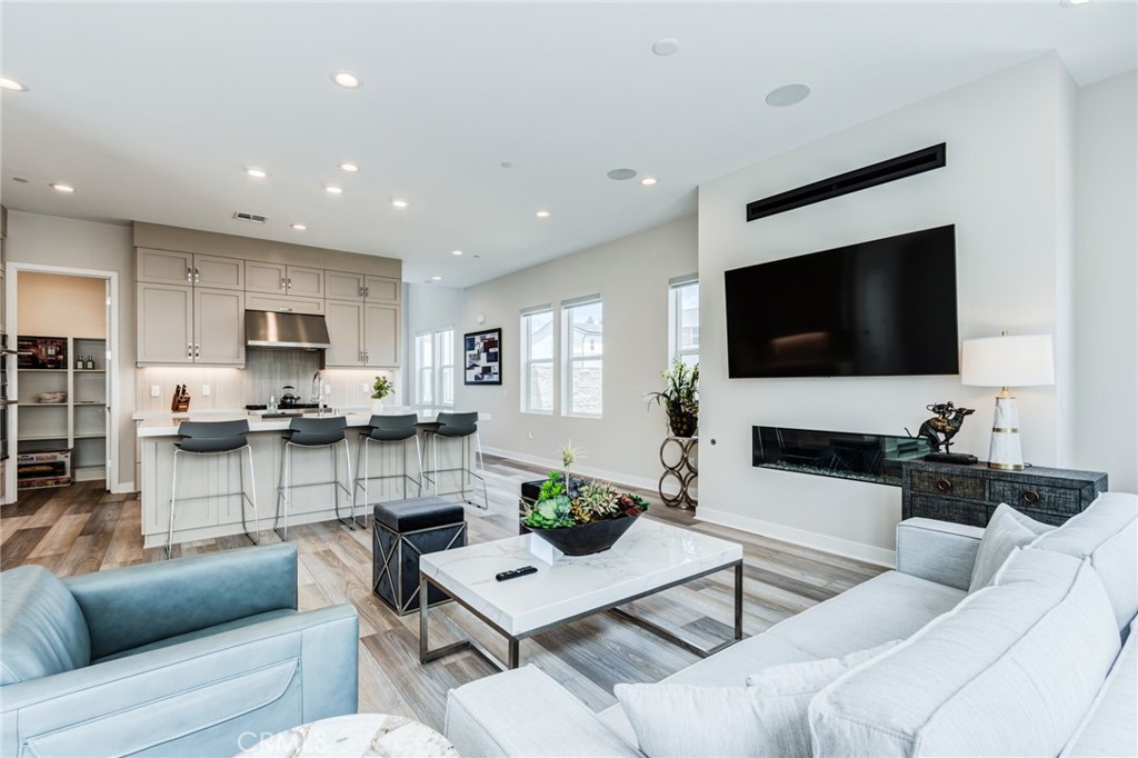 260 Holliston Lake Forest, CA 92630 - Photo 22 of 63 a living room with furniture and a flat screen tv