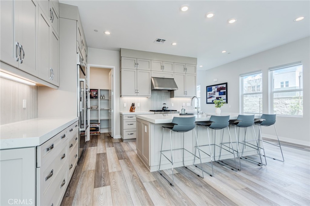 260 Holliston Lake Forest, CA 92630 - Photo 27 of 63 a kitchen with stainless steel appliances kitchen island granite countertop a sink and cabinets