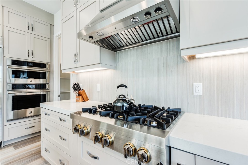 260 Holliston Lake Forest, CA 92630 - Photo 29 of 63 a kitchen with a sink a stove and cabinets