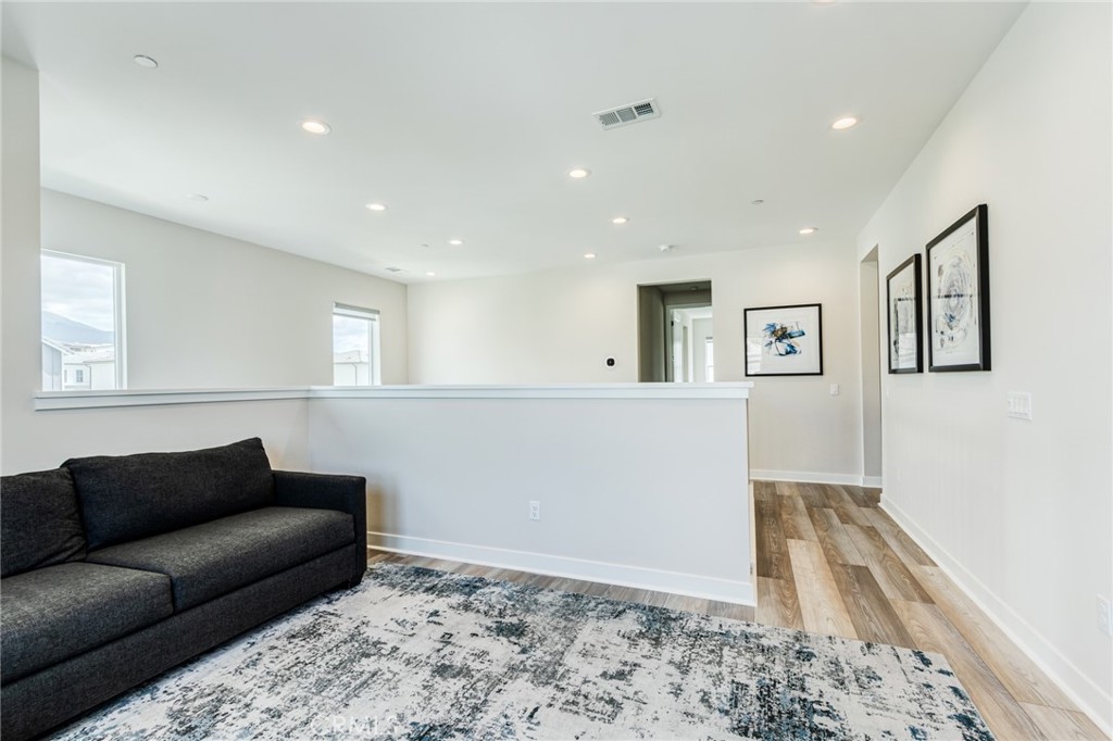 260 Holliston Lake Forest, CA 92630 - Photo 34 of 63 a living room with a couch and a rug