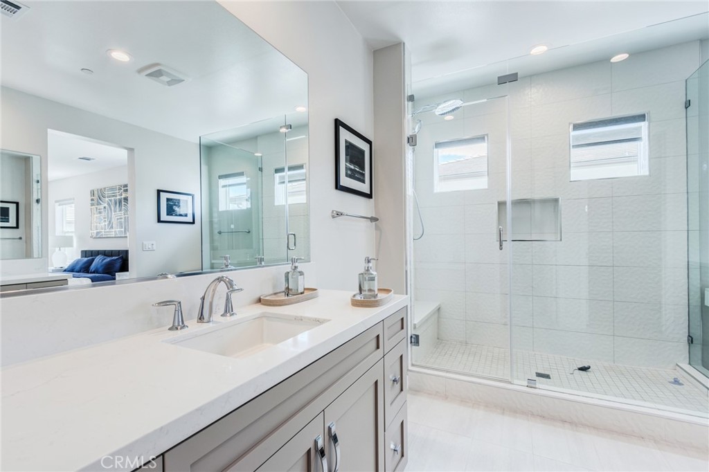 260 Holliston Lake Forest, CA 92630 - Photo 42 of 63 a bathroom with a shower tub sink and mirror