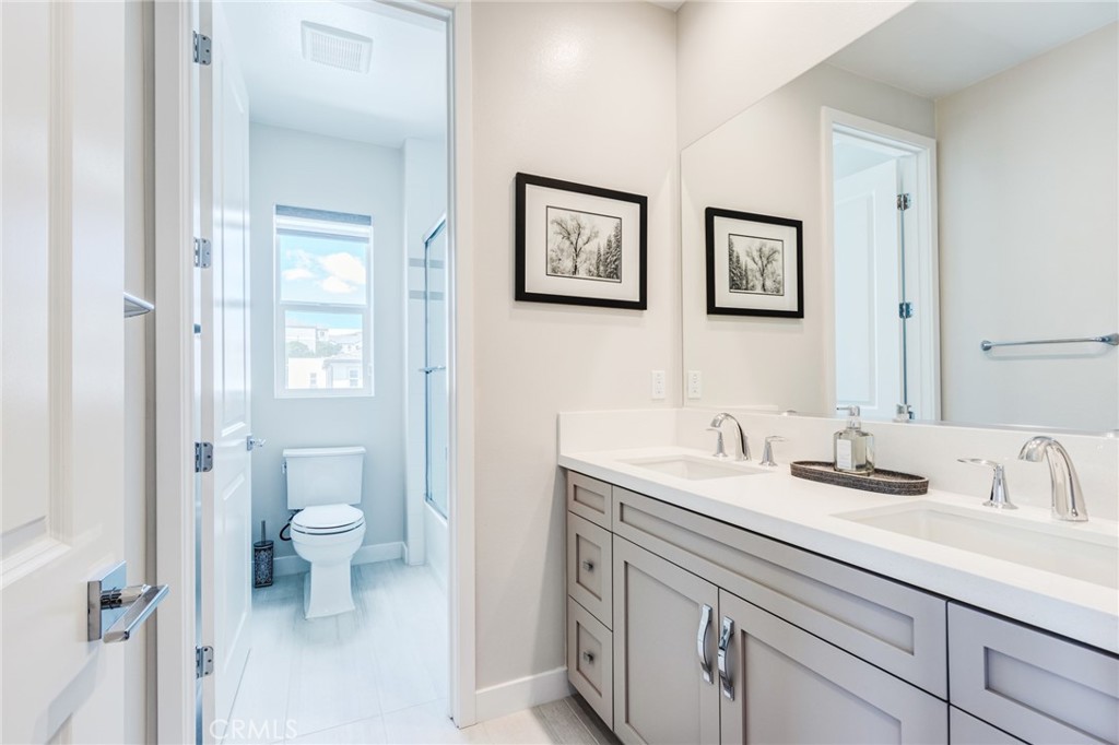 260 Holliston Lake Forest, CA 92630 - Photo 46 of 63 a bathroom with a sink a toilet and a mirror
