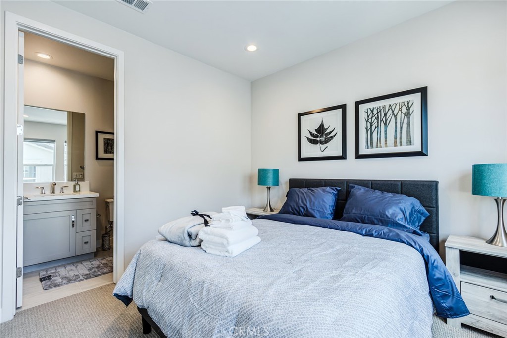 260 Holliston Lake Forest, CA 92630 - Photo 48 of 63 a bedroom with a bed and cabinets