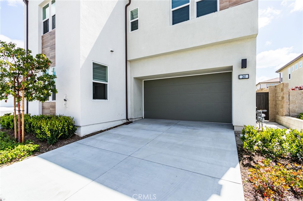 260 Holliston Lake Forest, CA 92630 - Photo 8 of 63 a front view of a house with potted plants