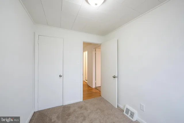 a view of a room with a hallway