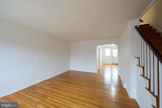a view of a room with wooden floor and stairs
