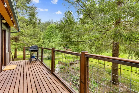 a view of a balcony with wooden floor