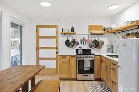 a kitchen with stainless steel appliances granite countertop a stove and a refrigerator
