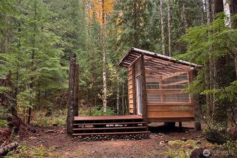 a view of swimming pool with yard in front of it