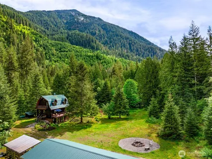 a backyard with table and chairs