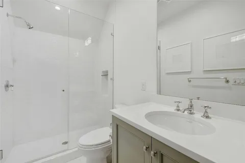 a view of a storage and utility room with washer and dryer