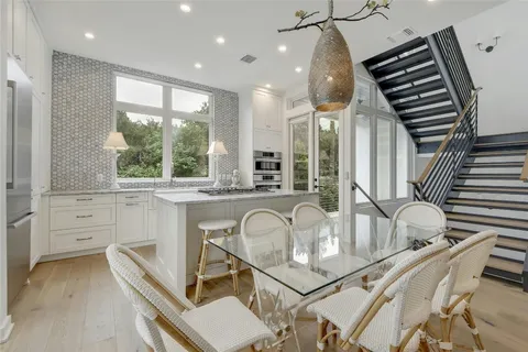 a very nice looking room with a large window and furniture