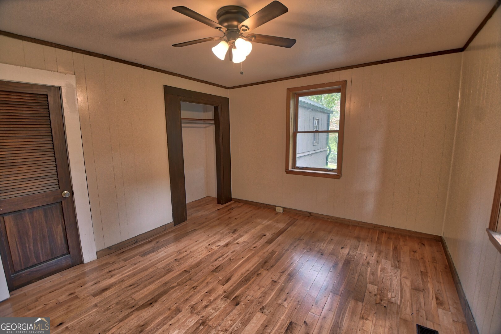 66 Post Oak Street Clayton, GA 30525 - Photo 12 of 17 a view of an empty room with wooden floor and a window