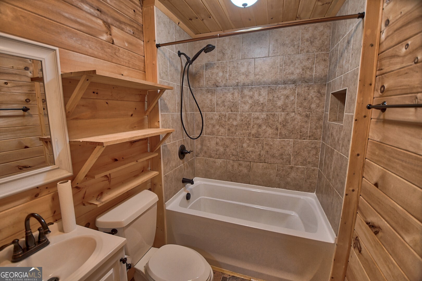 66 Post Oak Street Clayton, GA 30525 - Photo 13 of 17 a bathroom with a sink and a bathtub