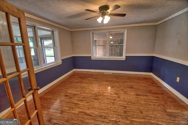 a view of an empty room and window