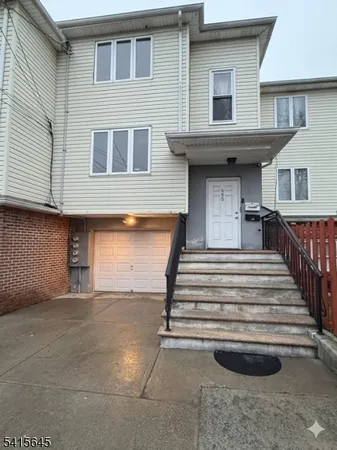 a front view of a house with stairs