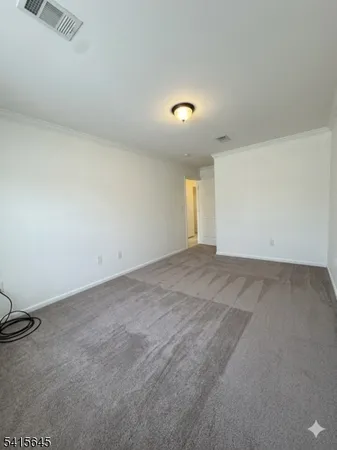 an empty room with a empty space and window