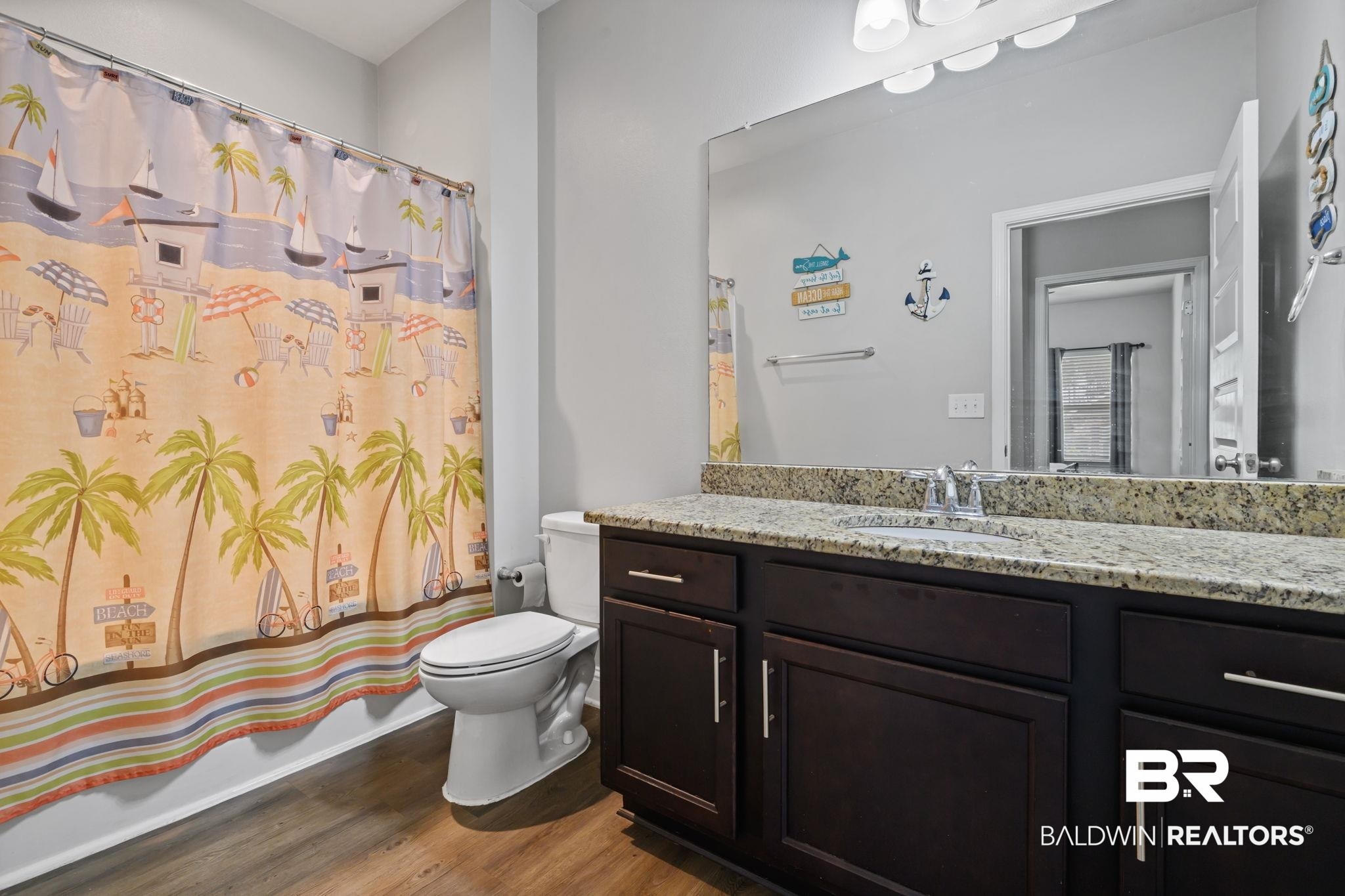 12693 Waxwing Avenue Daphne, AL 36527 - Photo 28 of 43 Bathroom featuring vanity, dark wood-type flooring, and shower / bathtub combination with curtain