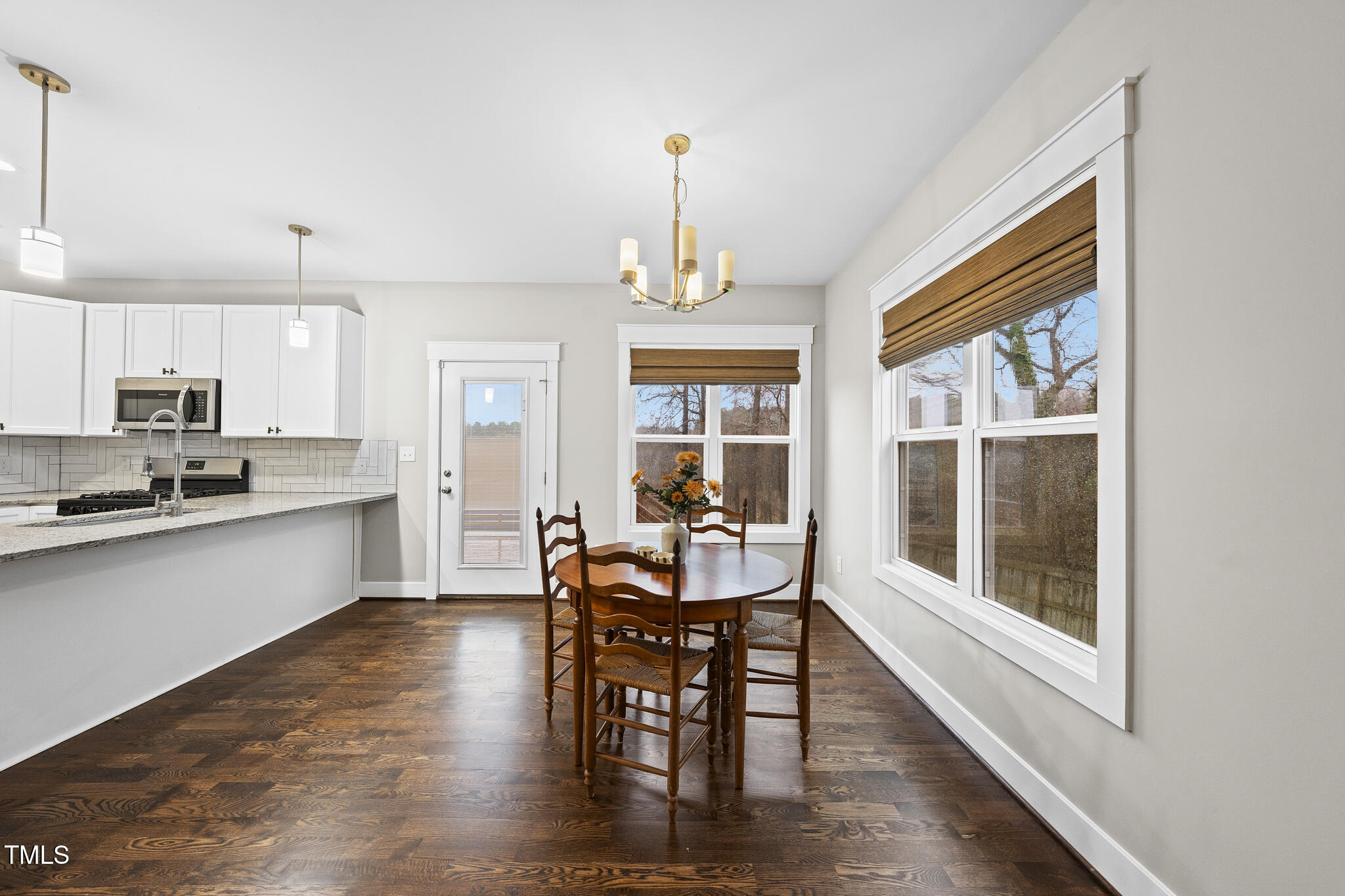 2717 Newbold Street Raleigh, NC 27603 - Photo 7 of 29 a view of a dining room with furniture window and wooden floor