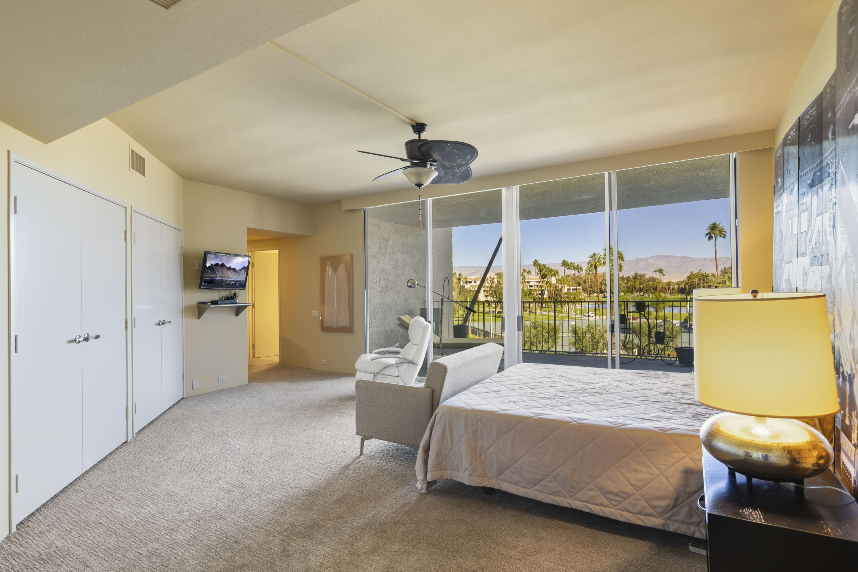 899 Island Drive, Unit 402 Rancho Mirage, CA 92270 - Photo 13 of 40 a living room with furniture and wooden floor