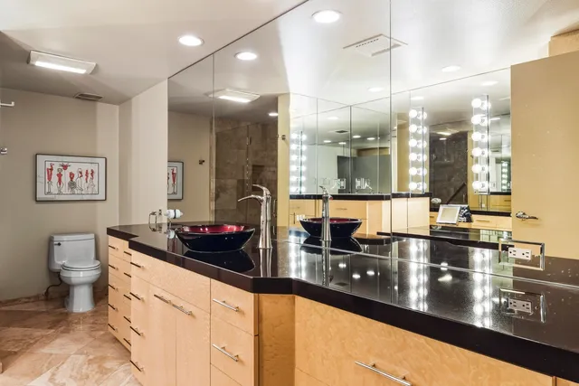 a bedroom with a bed and a couch