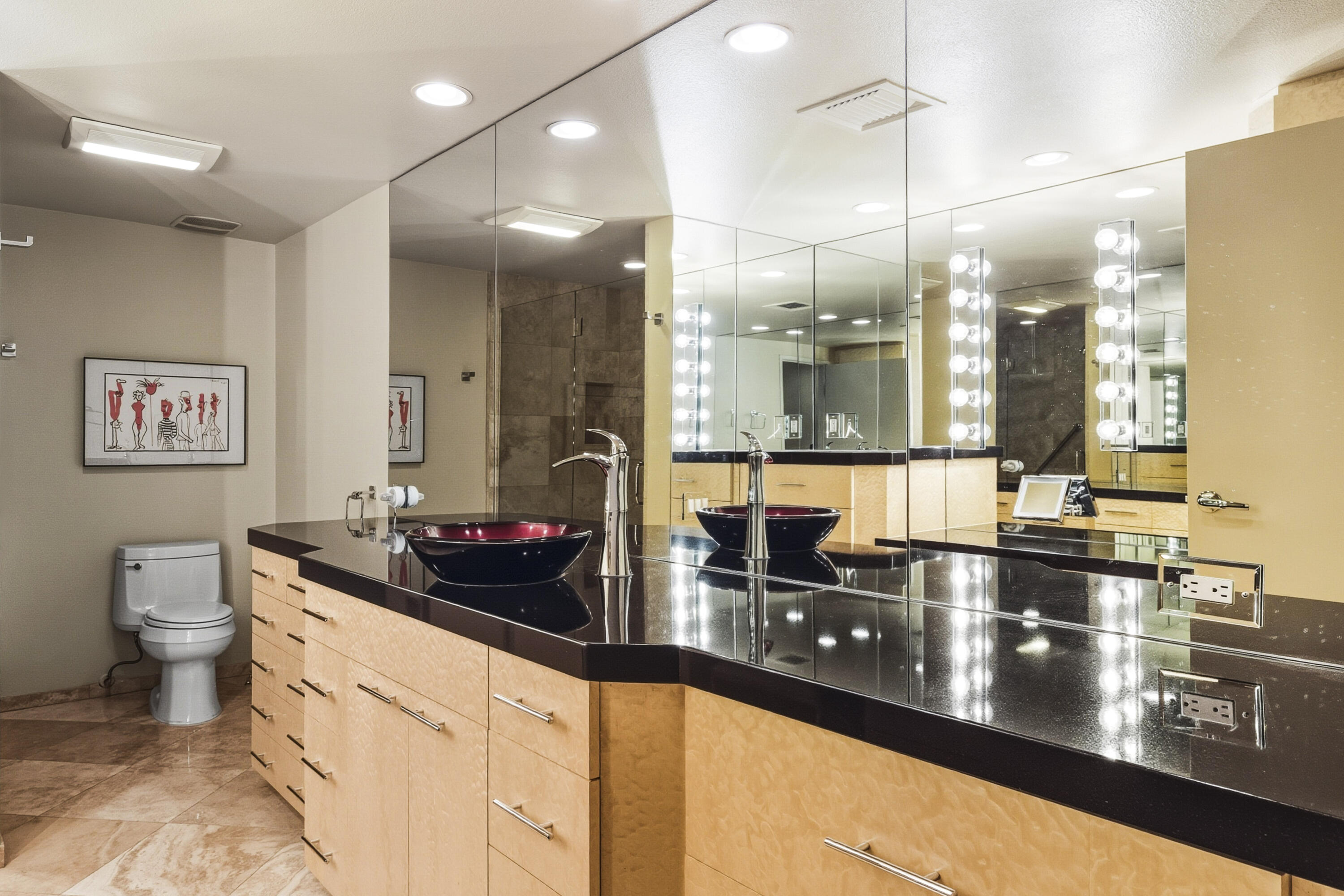899 Island Drive, Unit 402 Rancho Mirage, CA 92270 - Photo 14 of 40 a kitchen with stainless steel appliances a sink and a view of living room