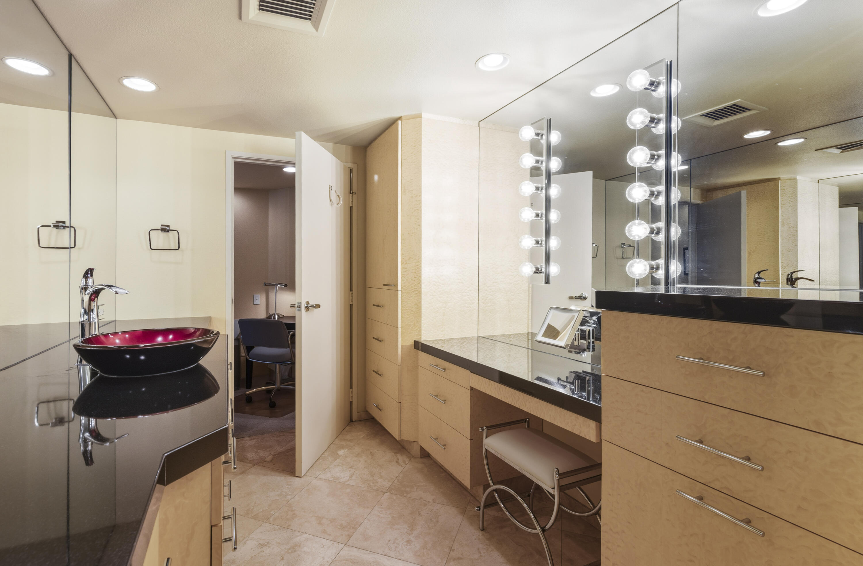 899 Island Drive, Unit 402 Rancho Mirage, CA 92270 - Photo 15 of 40 a bathroom with a double vanity sink mirror and shower