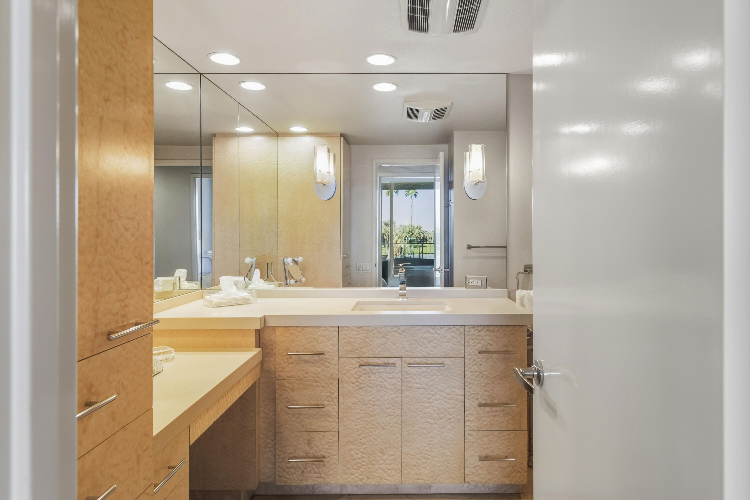 899 Island Drive, Unit 402 Rancho Mirage, CA 92270 - Photo 20 of 40 a bathroom with a sink a large mirror and a shower