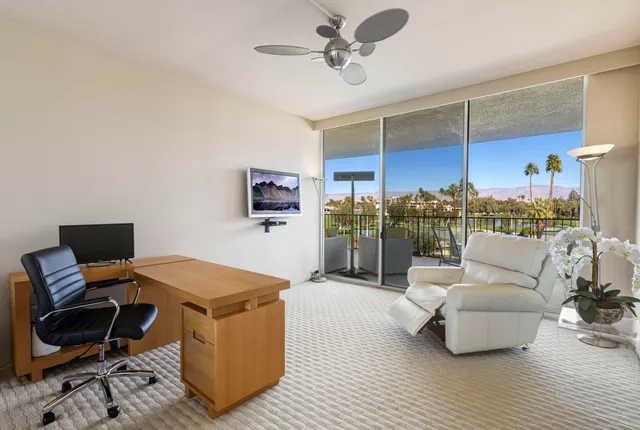 a view of living room with balcony and furniture