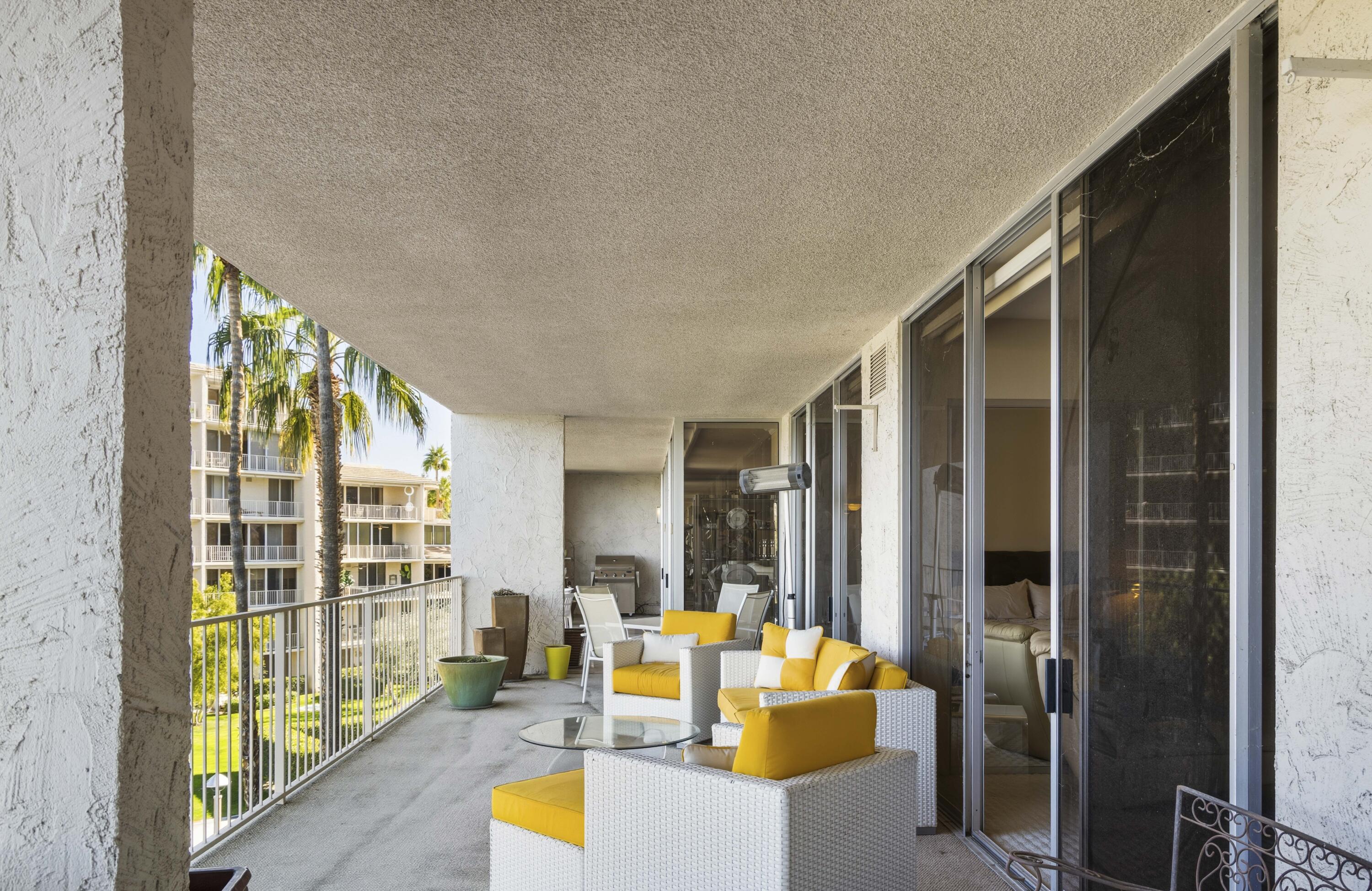 899 Island Drive, Unit 402 Rancho Mirage, CA 92270 - Photo 27 of 40 a view of living room with balcony and furniture