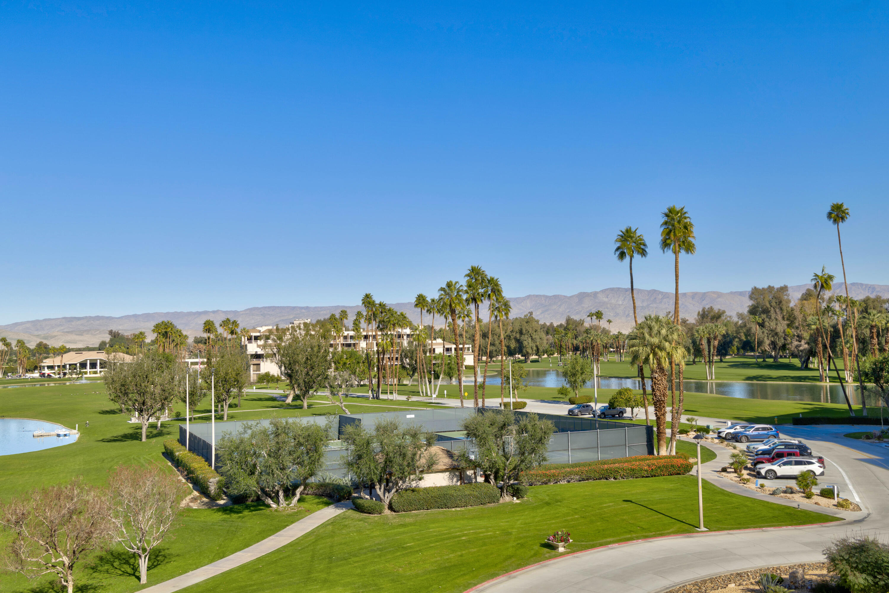 899 Island Drive, Unit 402 Rancho Mirage, CA 92270 - Photo 34 of 40 a view of a park with large trees