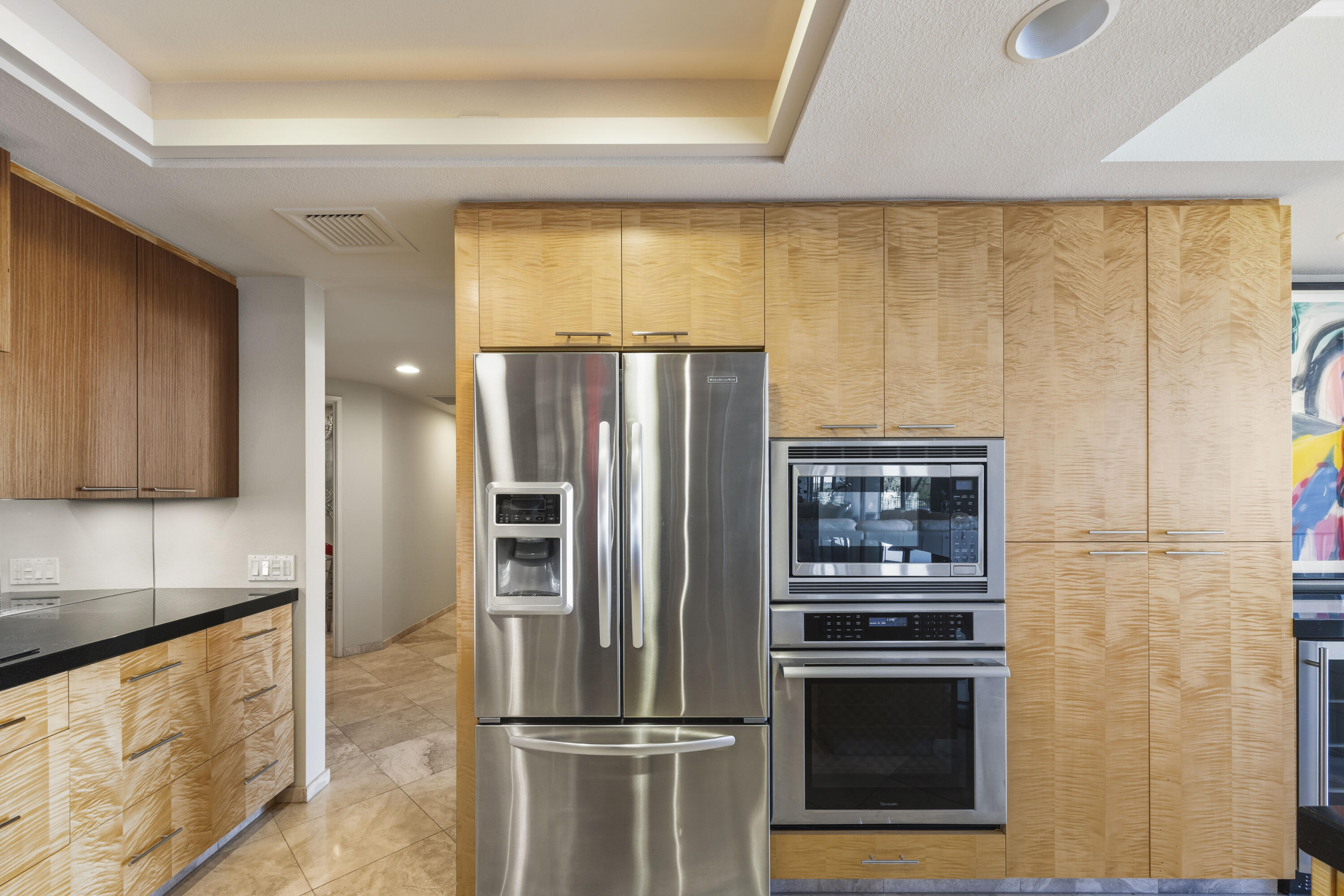 899 Island Drive, Unit 402 Rancho Mirage, CA 92270 - Photo 7 of 40 a kitchen with stainless steel appliances granite countertop a refrigerator and a stove top oven