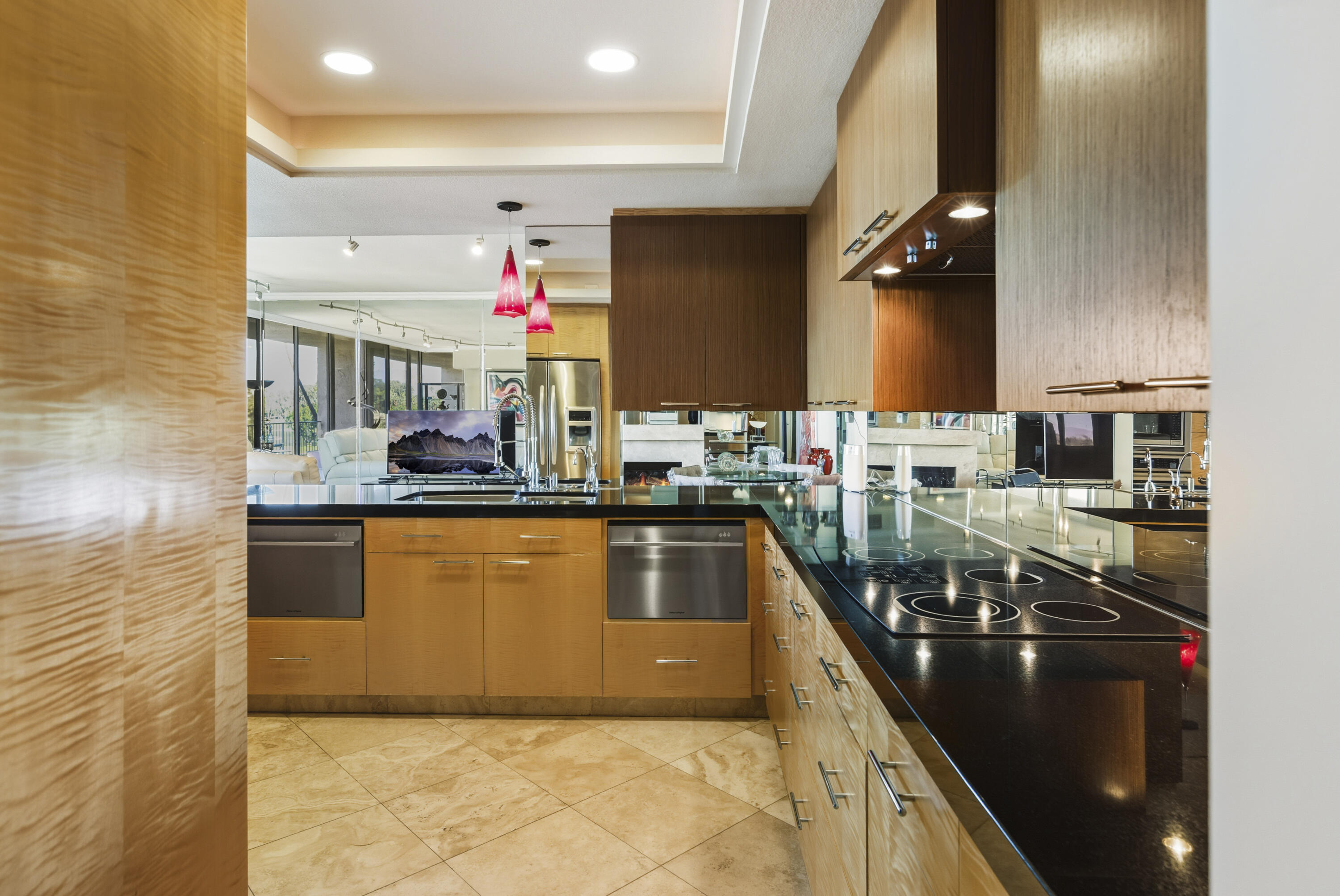 899 Island Drive, Unit 402 Rancho Mirage, CA 92270 - Photo 9 of 40 a kitchen with stainless steel appliances granite countertop a sink and a counter top space