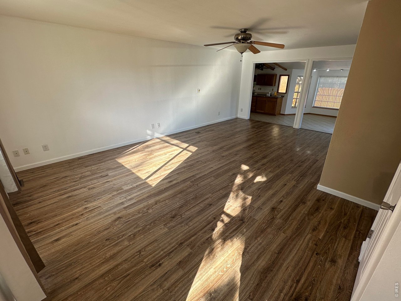 268 Fifth Street Firestone, CO 80520 - Photo 10 of 25 a view of empty room with wooden floor