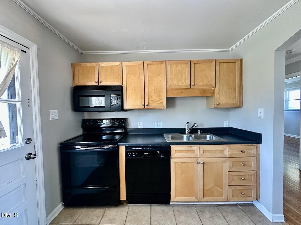 2333 Bernard Street Raleigh, NC 27608 - Photo 10 of 19 a kitchen with granite countertop a stove and a microwave