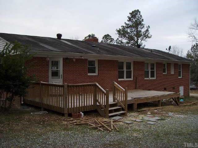 5417 Rock Quarry Road Raleigh, NC 27610 - Photo 2 of 10 a view of a house with a yard and deck