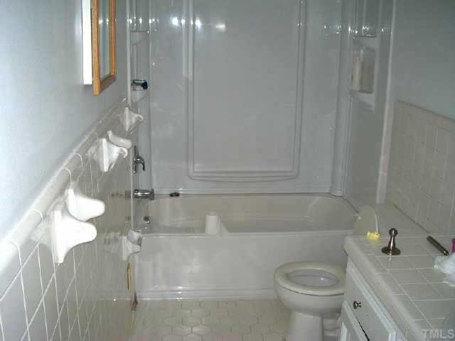 5417 Rock Quarry Road Raleigh, NC 27610 - Photo 10 of 10 a bathroom with a sink a toilet and shower
