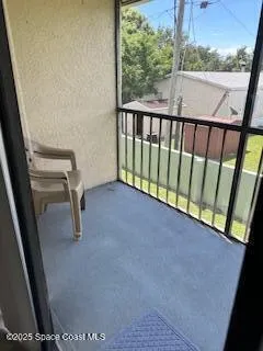 a view of balcony with furniture