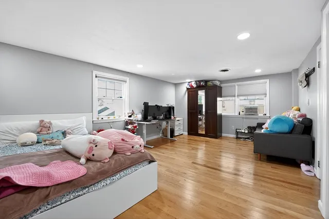 a bathroom with a sink a toilet and a window