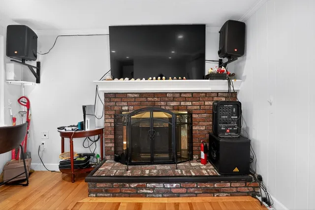 a view of a hallway view with wooden floor and staircase