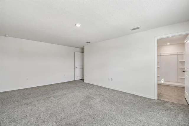 a bathroom with a granite countertop sink mirror and toilet