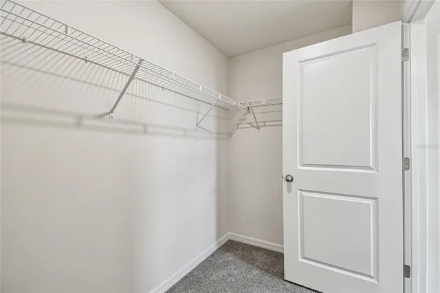 an empty room with closet area
