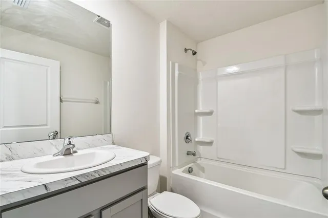 an empty room with a bathroom