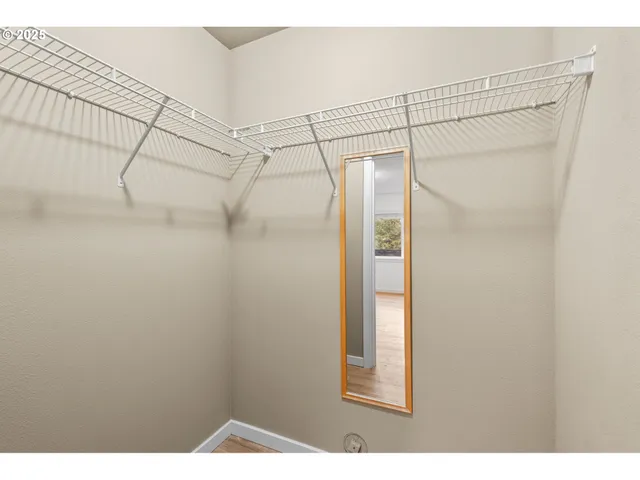 a bathroom with a shower and a glass door