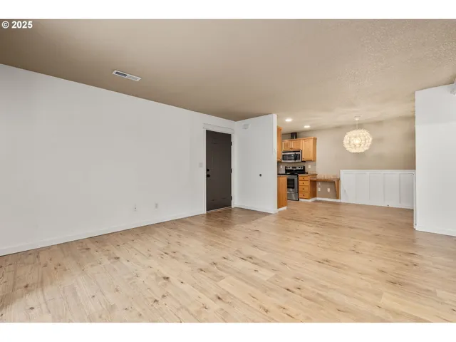 a view of a big room with wooden floor
