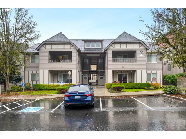 a front view of a house with a yard table and chairs